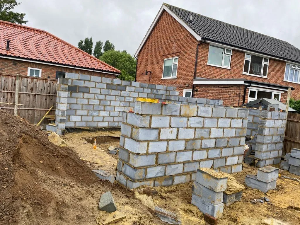 A house being built in a residential area.