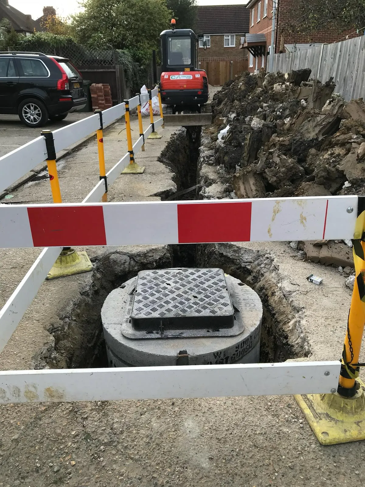 A construction site with a hole in the ground.