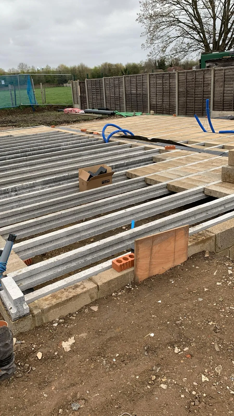 A picture of a building being built with a lot of pipes.